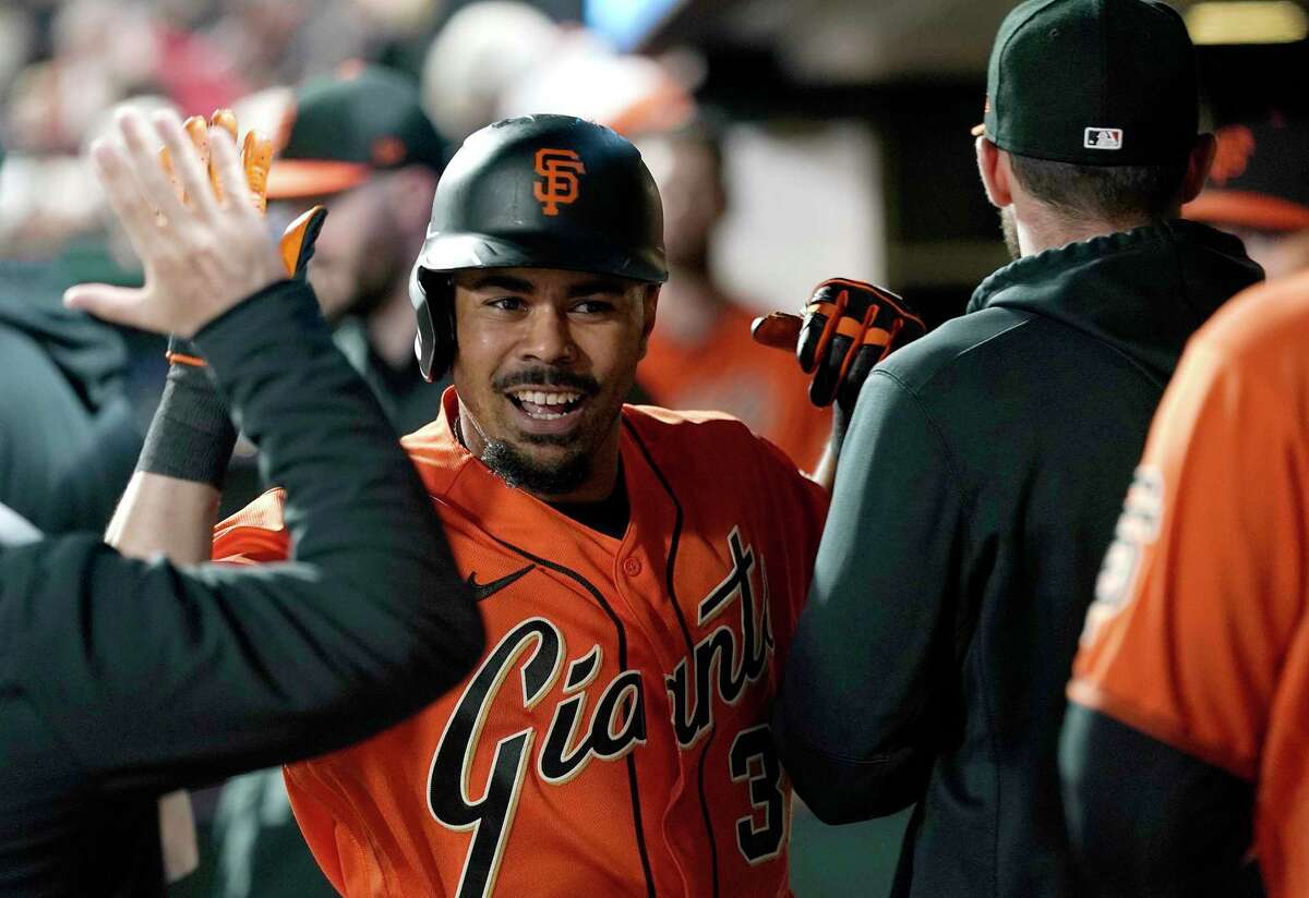 LaMonte Wade Jr. #31 of the San Francisco Giants warms up before