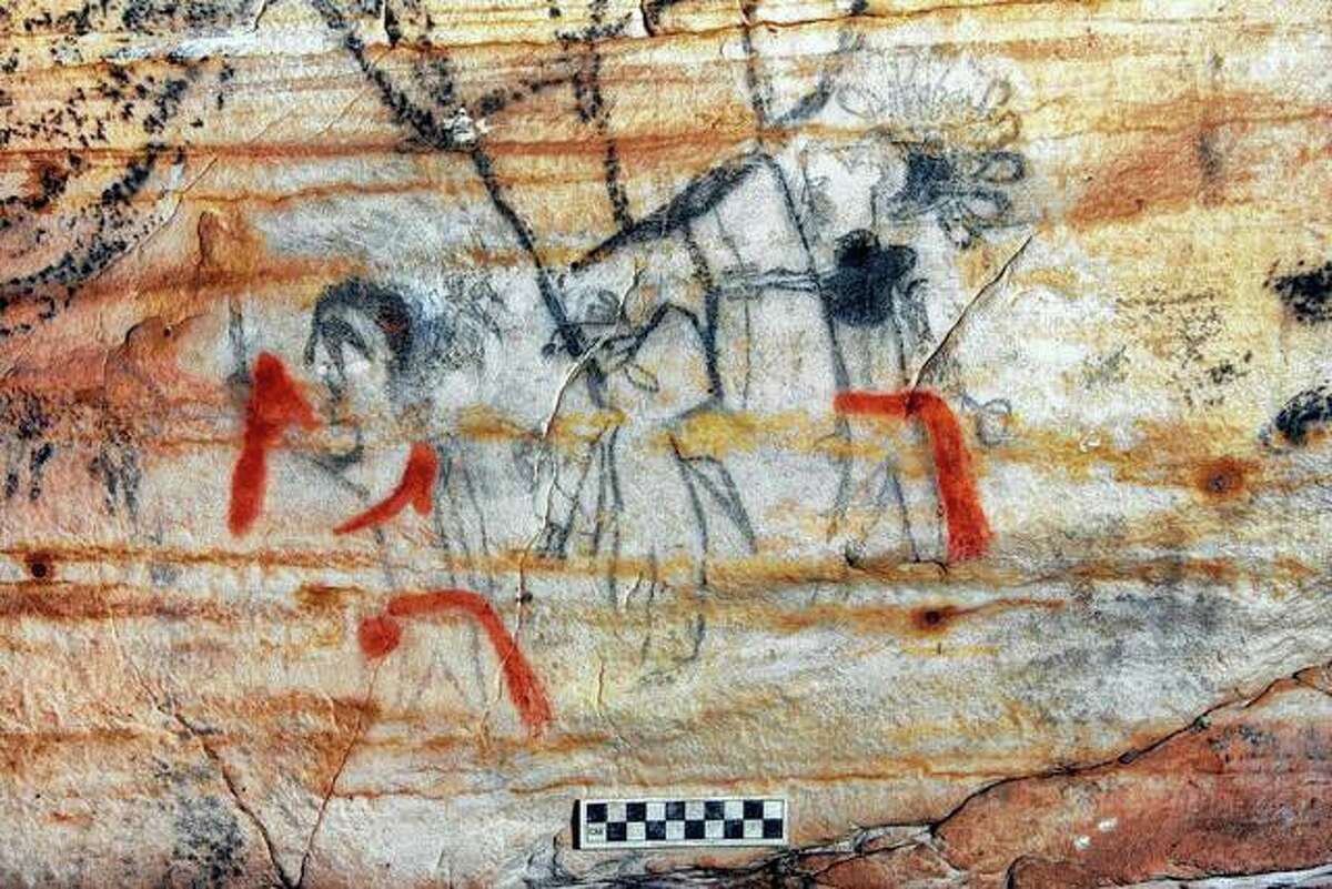 An undated photo provided by Alan Cressler shows a Missouri cave featuring artwork from the Osage Nation dating back more than 1,000 years. The cave was sold at auction this week. The art inside “Picture Cave” shows humans, animals and mythical creatures.