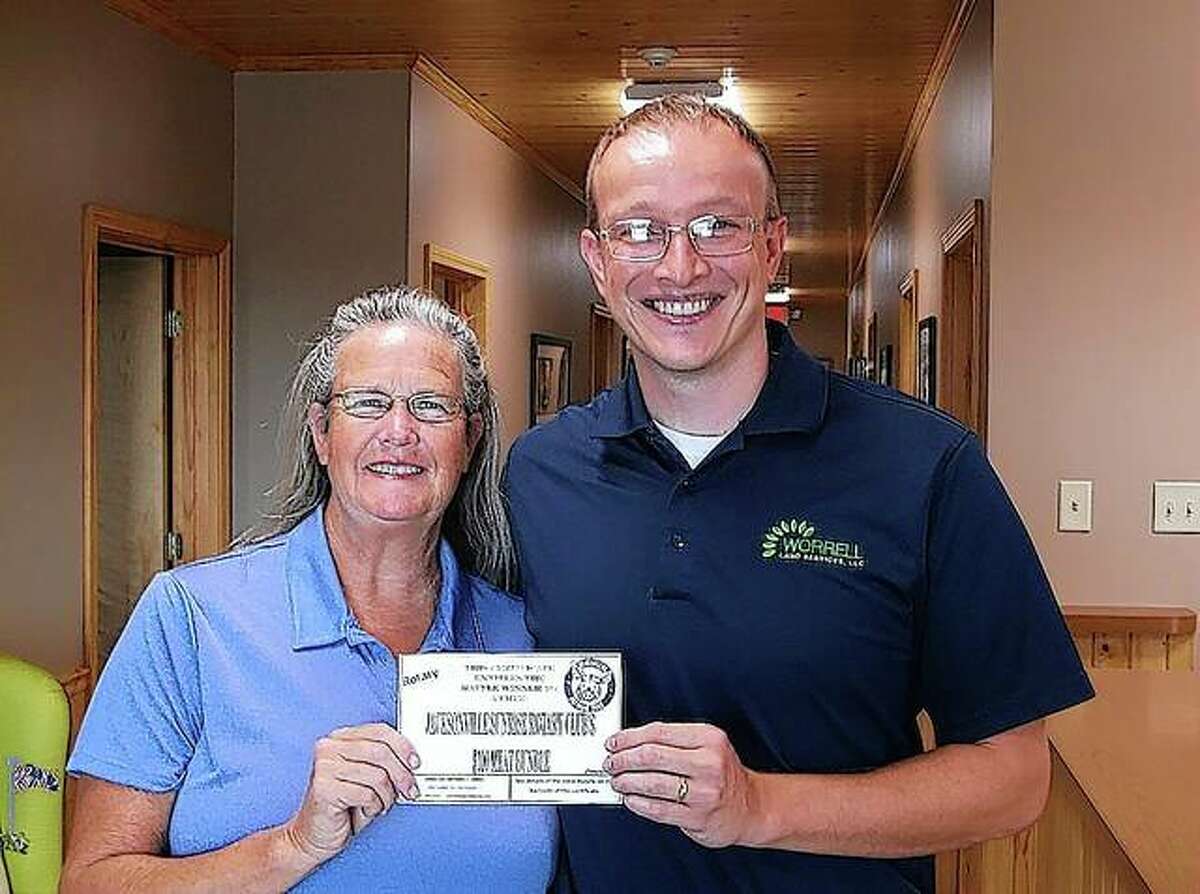 Luke Worrell (right) was one of two winners of Sunrise Rotary Club’s Pork Bundle Blast raffle. Worrell received his certificate, worth $100 worth of premium meat, from club President Jane Becker.