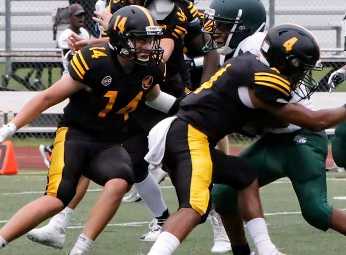 Law's DeShon Cummings (4) and Jack Sellman (14) look to make a play in the win over Bassick