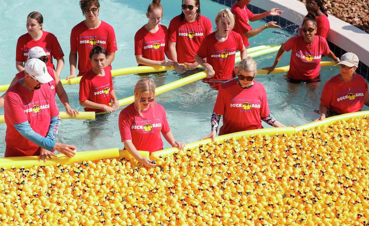 Volunteers with the Community Assistance Center take part in the organization’s duck race at Big Rivers Waterpark, Saturday, Sept. 18, 2021, in New Caney. The annual event raises money for the non-profit that provides resources and needs to struggling individuals and families in Montgomery County. This year's duck race is set for Sept. 24.