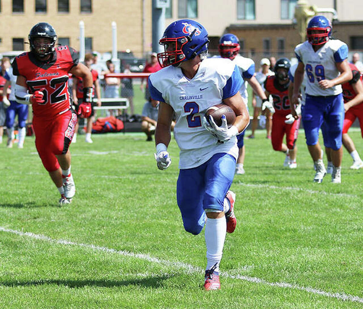 Carlinville’s Carson Wiser runs from defenders in a Week 1 win at Gibson City. On Friday in Gillespie, Wiser had nine receptions for 126 yards in the Cavaliers’ SCC win over the Miners.