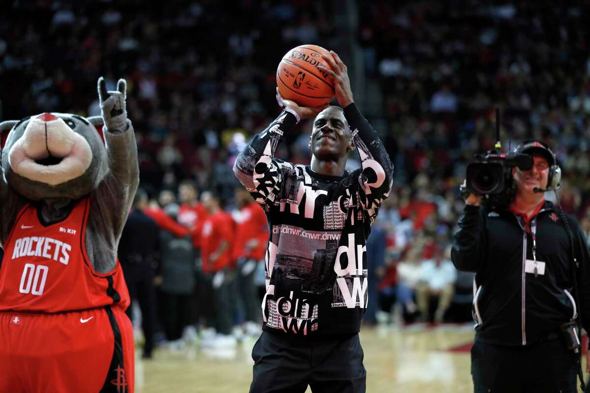 Former Houston Rockets Vernon Maxwell tries to shoot a basket before the start of the first half of an NBA basketball game at Toyota Center in Houston, Sunday, Feb. 2, 2020.