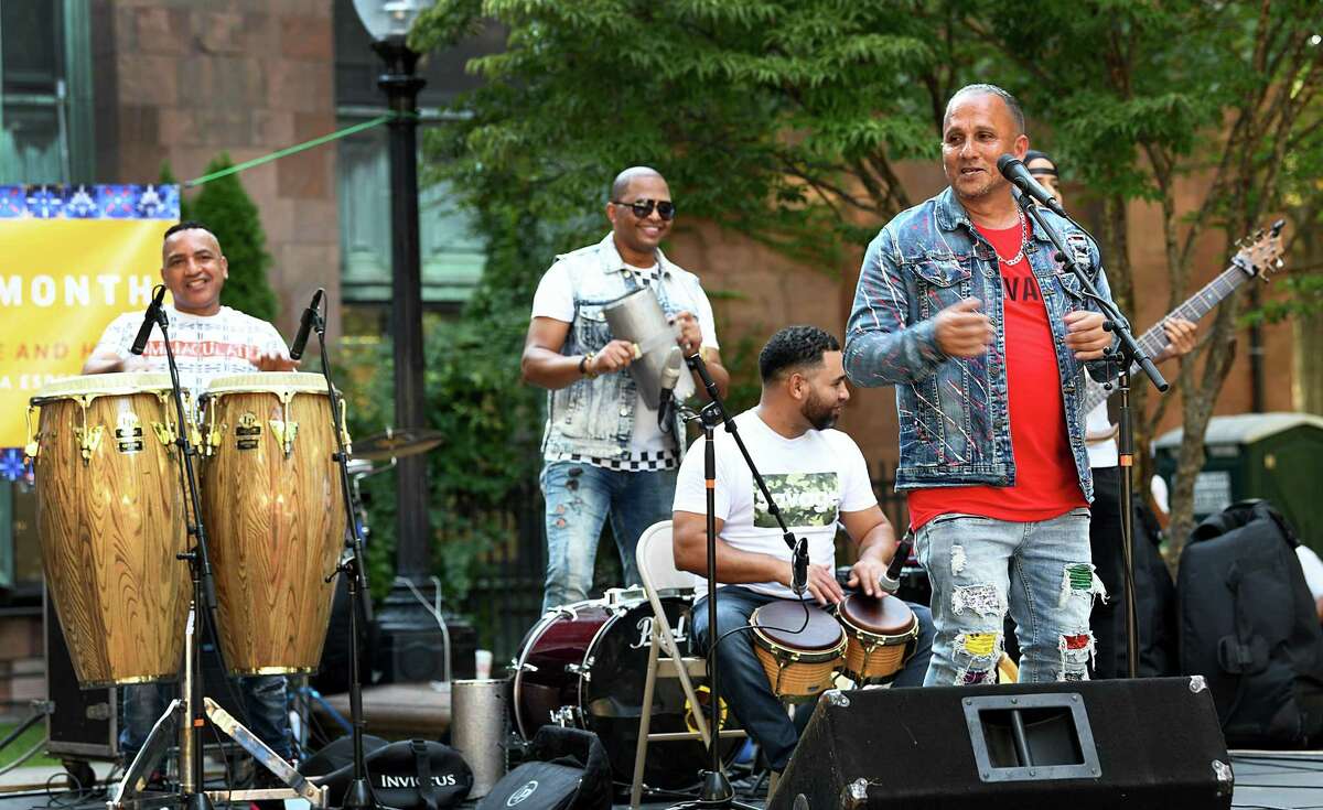 Joe Velez, right, and members of his Latin band, perform on the McLevy Green for Spanish Heritage Month Bridgeport, Saturday, Sept. 18, 2021.