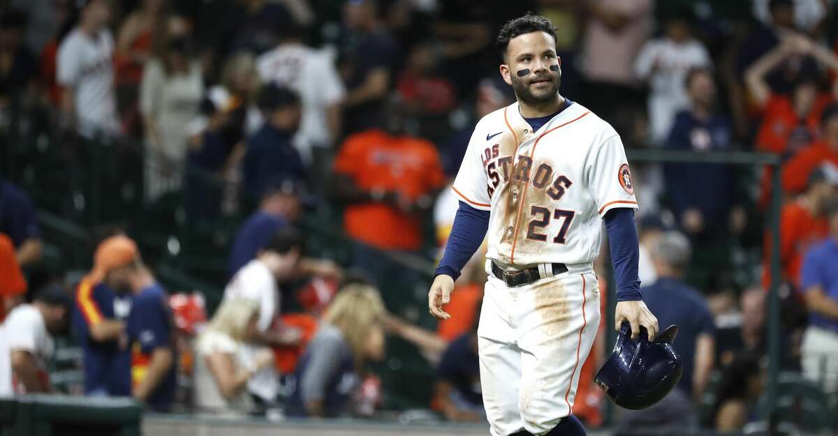 Houston Astros' Lance Berkman walks off the field after striking