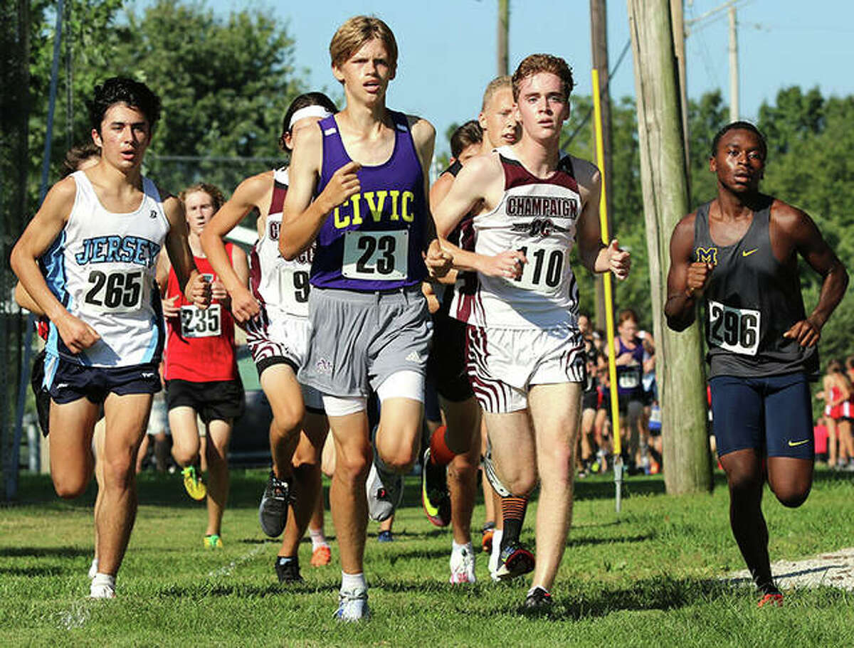 From left, Jersey’s Cole Martinez, CM’s Justice Eldridge, Champaign Central’s Peter Smith and Marion’s Benja Stone lead a pack of runner Saturday in the Highland Invite at Alhambra.