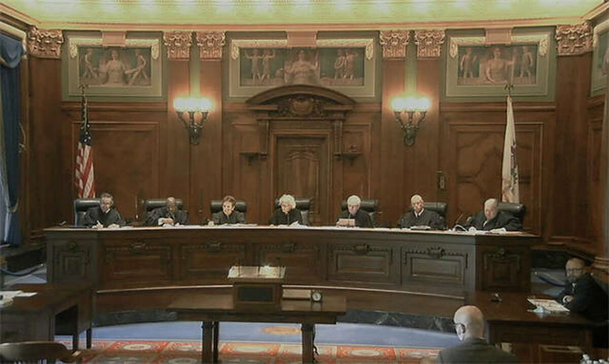 Members of the Illinois Supreme Court hear oral arguments in Springfield.