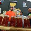 Contestants get ready to compete in a steinholding competition at Third Place Saturday, September 18, 2021, in Stamford, Conn. Third Place by Half Full Brewery is kicking off their Oktoberfest celebrations this weekend with the steinholding competition..