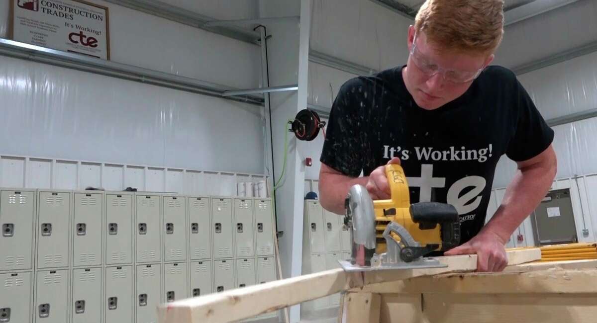 Students like Gladwin Senior Hunter Huguelet must learn proper safety techniques with all tools before using them in the Construction Trades lab. (Photo provided)