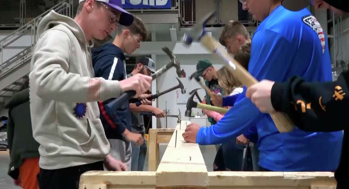 A nail driving competition helps build teamwork, as well as allowing students the opportunity to figure out what type of hammer suits them best. (Photo provided)