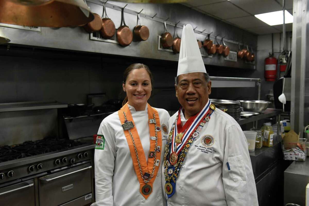 Chef Gabriella O'Neil, left, with her mentor, chef and restaurateur Yono Purnomo on Thursday, Sept. 9, 2021, in the kitchen at Yono's, dp An American Brasserie in Albany N.Y. O?•Neil a few months ago won the U.S competition for young chefs sponsored by the international culinary organization Chaine des Rotisseurs. In late September she will be the sole competitor representing the U.S. in a Chaine cook-off in Paris.