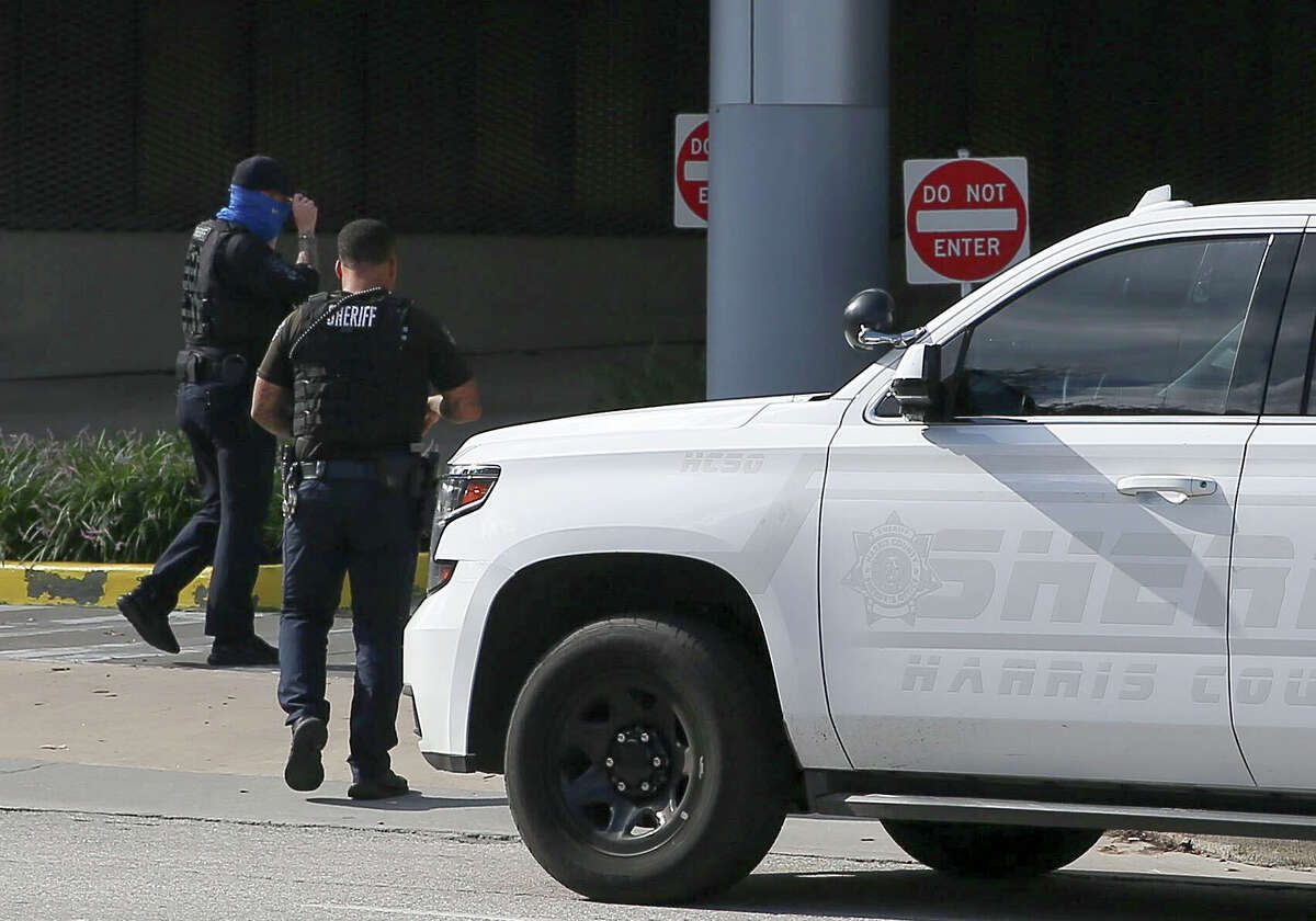 Sheriff's deputies arrive in front of Memorial Hermann ER.  Two police officers were gunned down after police served an arrest warrant at a Harris County compound on Monday, September 20, 2021.