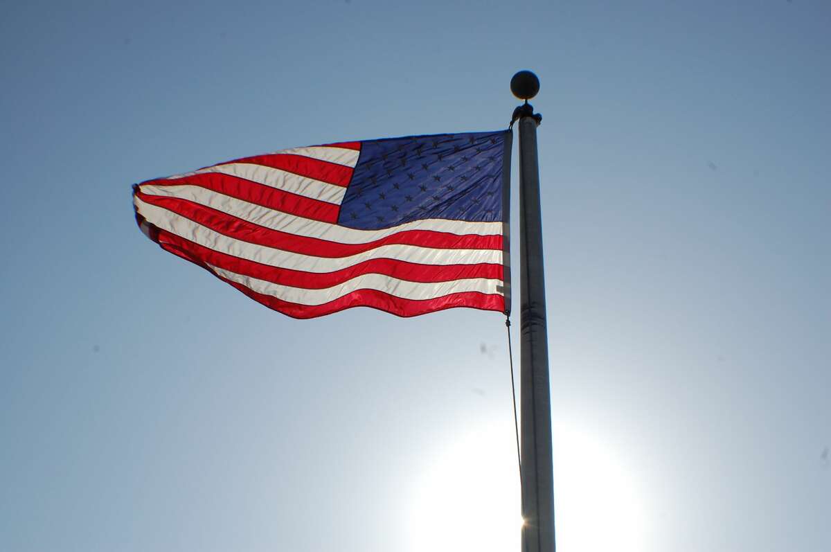 The US flag flies high on a bright, sunny day aboard the Spirt of Peoria riverboat. 