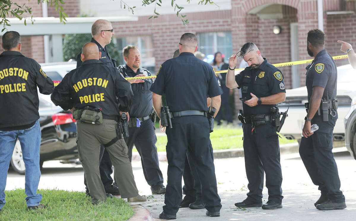Police investigate a shooting Timber Ridge Apartments where a police officer and the suspect were killed in Houston on Monday, Sept. 20, 2021.