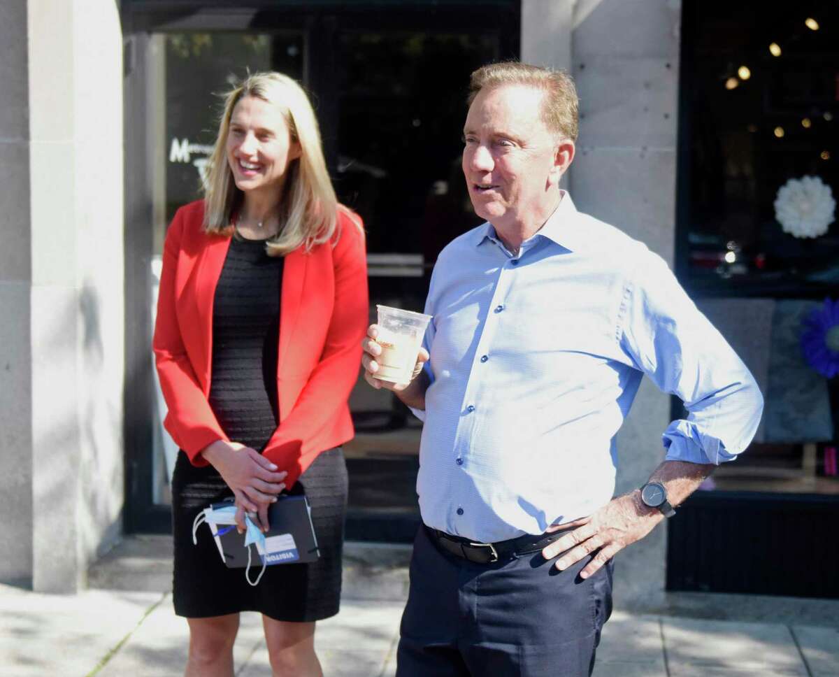 Connecticut Gov. Ned Lamont and Stamford Democratic mayoral candidate Caroline Simmons visit Lorca coffee shop in Stamford, Conn. Monday, Sept. 20, 2021. Gov. Lamont visited Stamford Monday to talk with small businesses and endorse Caroline Simmons for Mayor of Stamford.