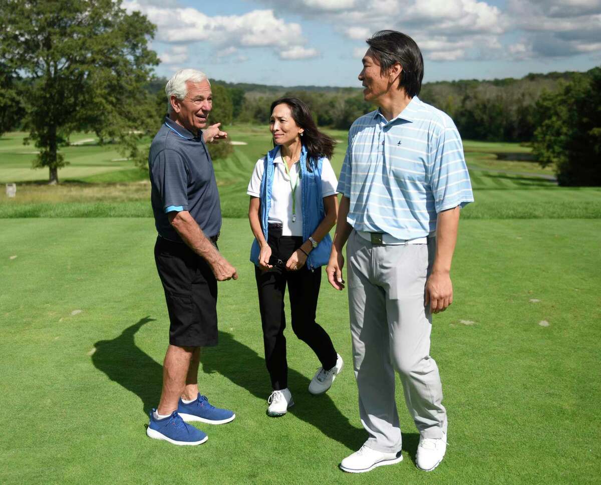 Former baseball manager and current Stamford mayoral candidate Bobby Valentine, left, Global Citizens Initiative Founder and President Yumi Kuwana, center, and former New York Yankees baseball player Hideki Matsui chat at the Champion a Champion Golf Classic at Tamarack Country Club in Greenwich, Conn. Monday, Sept. 20, 2021. The celebrity golf outing was a joint fundraiser between Greenwich-based non-profit Global Citizens Initiative and Hideki Matsui's non-profit Matsui 55 Baseball Foundation.
