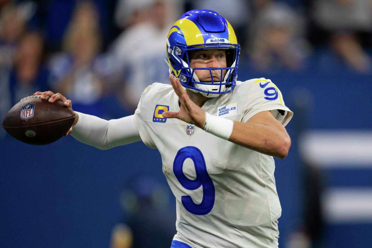 Los Angeles Rams quarterback Matthew Stafford throws on the run during an NFL football game against the Indianapolis Colts.