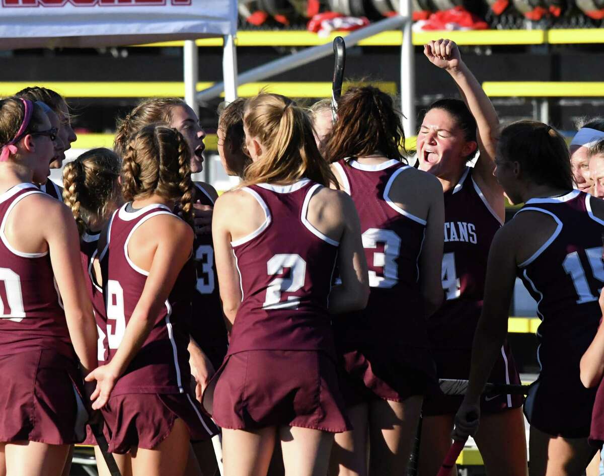 Burnt Hills-Ballston Lake field hockey players celebrate their 2-0 win over Guilderland on Monday evening, Sept. 20, 2021, at Afrim's Sports Park in Colonie, N.Y.