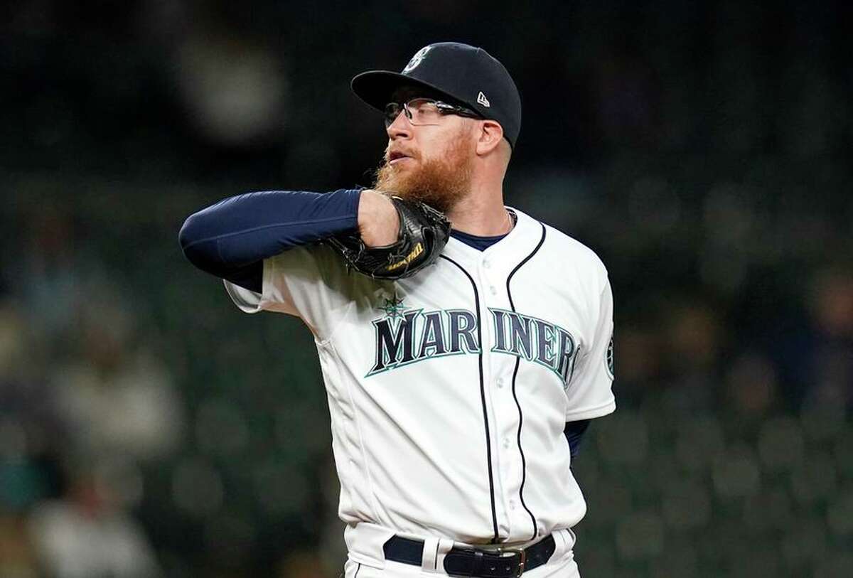 Seattle Mariners relief pitcher Sean Doolittle readies a pitch against the Arizona Diamondbacks in a baseball game Saturday, Sept. 11, 2021, in Seattle. (AP Photo/Elaine Thompson)