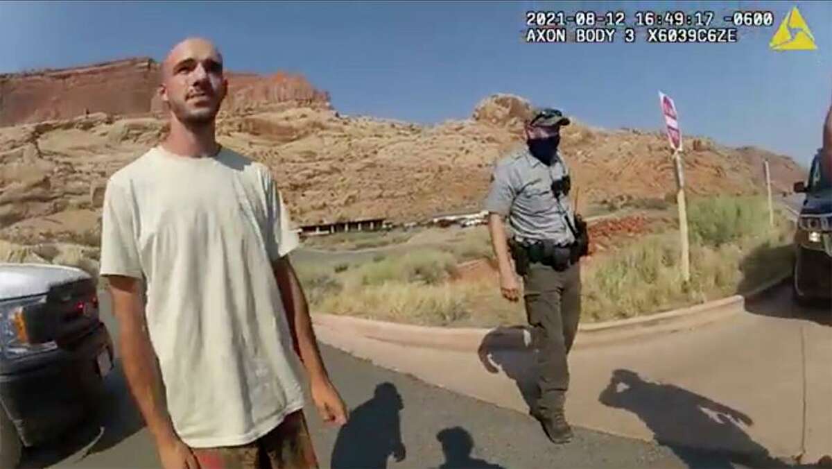 Image from Moab Police Department shows Brian Laundrie talking to a police officer after police pulled over his van. Riding with him was his girlfriend, Gabrielle “Gabby” Petito (right).