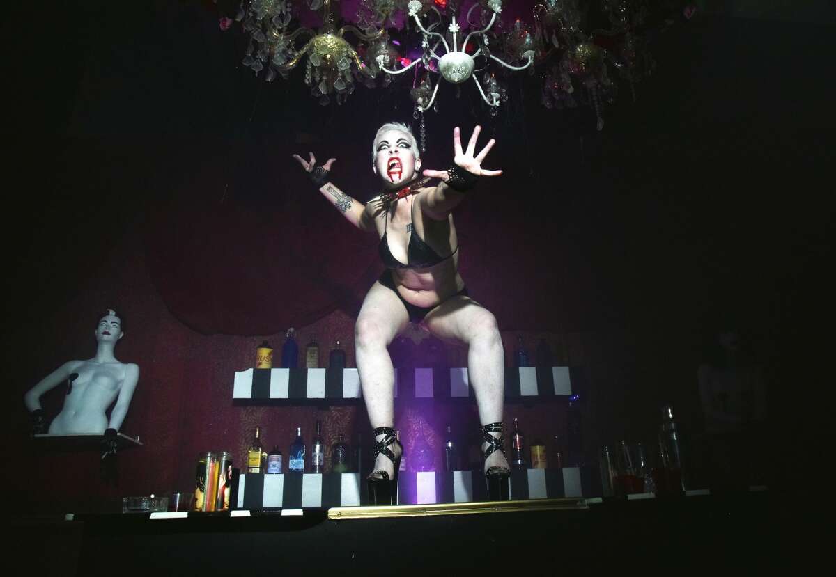 Former Lusty Lady dancer Roxanne Redmeat dances at "Croc-bang" disco inside "The Immortal Judgment" at the San Francisco Mint.