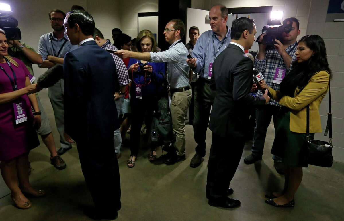 Secretary of Housing and Urban Development and former San Antonio mayor Julian Castro (left) and his twin brother U.S. Rep. Joaquin Castro, D-San Antonio, answer questions from the media after a press conference during the 2016 Texas Democratic Convention held Friday June 17, 2016 at the Alamodome.