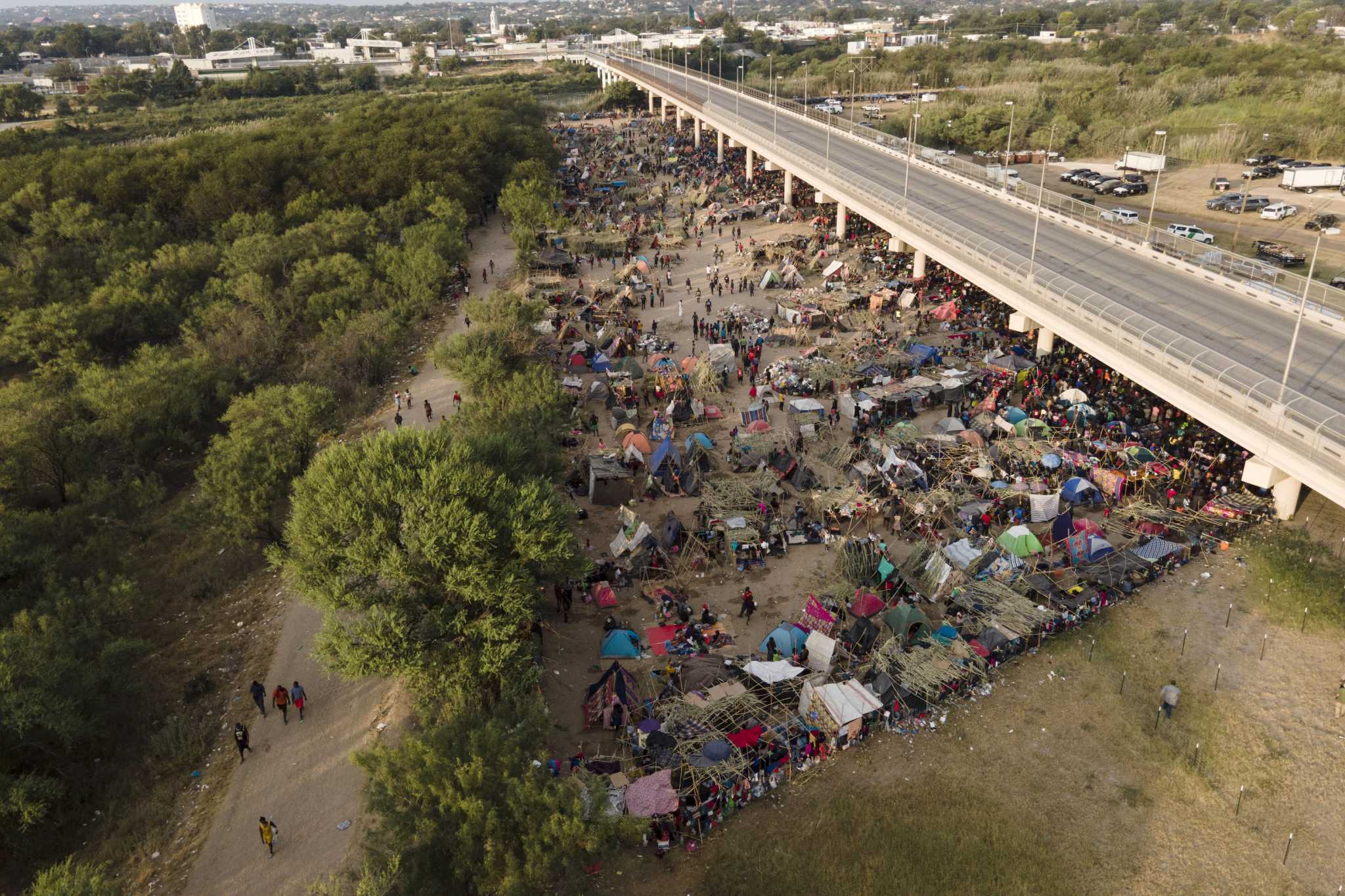 As White House Flies Haitians Home, Gov. Abbott Claims He’s Keeping ...