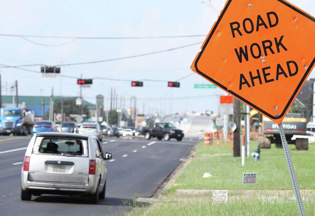 Traffic moves toward the intersection of FM 1960 and North Eldridge Parkway on Sept. 21, 2021, in Houston, one of several areas where crews are making road repairs. The project, along with dozens of others, was delayed this year, leading to an abundance of late projects piling up for transportation planners.