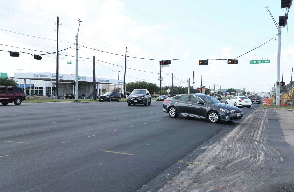 Traffic moves toward the intersection of FM 1960 and North Eldridge Parkway on Sept. 21, 2021, in Houston, one of several areas where crews are making road repairs. The project, along with dozens of others, was delayed this year, leading to an abundance of late projects piling up for transportation planners.