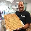 Owner Khaled H. Khaled holds one of his specialty baklavas at Nutcracker, his new family business at 1555 Black Rock Turnpike in Fairfield, Conn. on Tuesday, September 21, 2021.