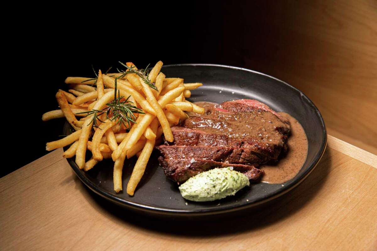 Steak Frites (grass-fed rib steak, Maître d'Hôtel butter, fries, sierra porcini sauce) at Range Life on Saturday, February 6, 2021, in Livermore, California.