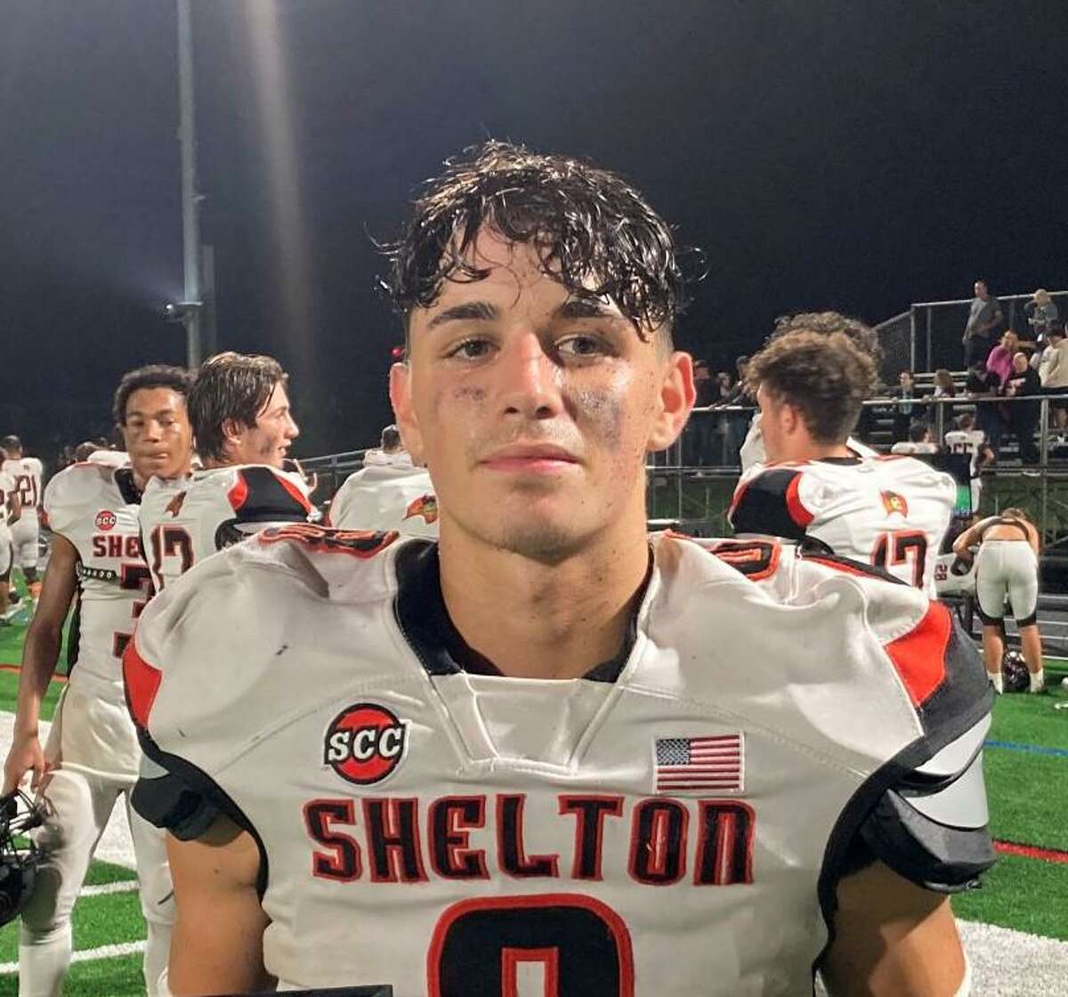 Shane Santiago ran for two touchdowns when Shelton defeated Amity 14-0.