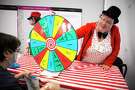 Girl Scout Troop 21 leader Tina Sabuco helps with a ticket prize wheel during the troop’s first meeting since the COVID-19 break on Saturday, Sept. 11, 2021.