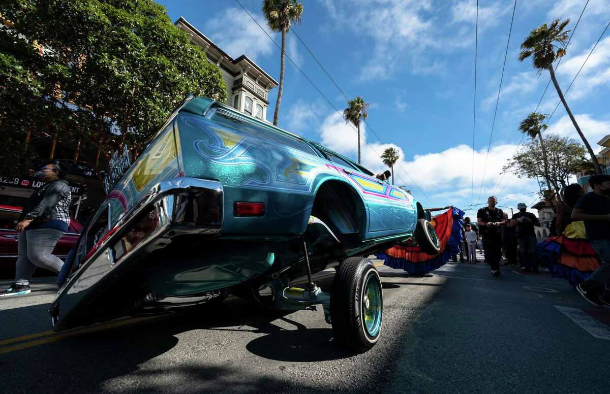 Lowrider owners and participants during the San Francisco Lowrider Council 40th Anniversary Celebration Exhibit and Cruise in front of the Mission Cultural Center in the Mission District of San Francisco, California. Sept 18, 2021. San Jose city officials on Tuesday repealed a decades-old ban on car cruising.
