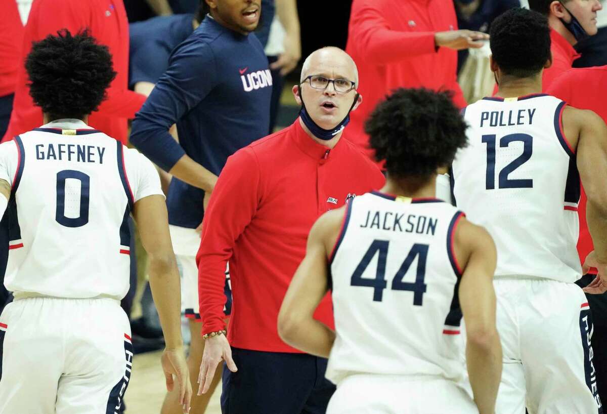 Connecticut head coach Dan Hurley greets his players a break against Georgetown in the first half of an NCAA college basketball game Saturday, March 6, 2021, in Storrs, Conn. (David Butler II/Pool Photo via AP)