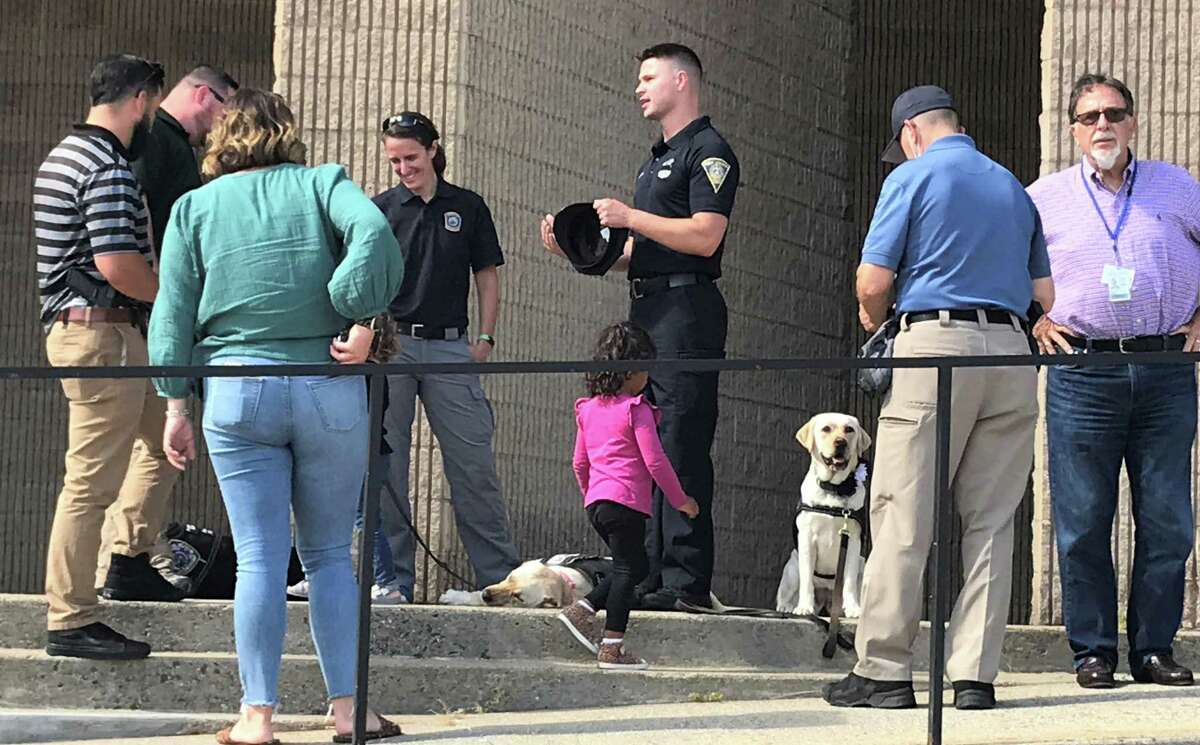 Police officers and canines outide the New Haven Police Department in honor of New Haven Officer Joshua Castellano, who was killed in a crash in Las Vegas on Sept. 17, 2021.