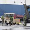 Members of the 842nd Transportation Battalion load helicopters and other military vehicles onto a vessel docked at the Port of Beaumont. The cargo is bound for Europe to be used in military training with NATO allies. A second vessel arrives Monday to transport the remaining cargo from the port. Photo taken Thursday, February 4, 2021 Kim Brent/The Enterprise