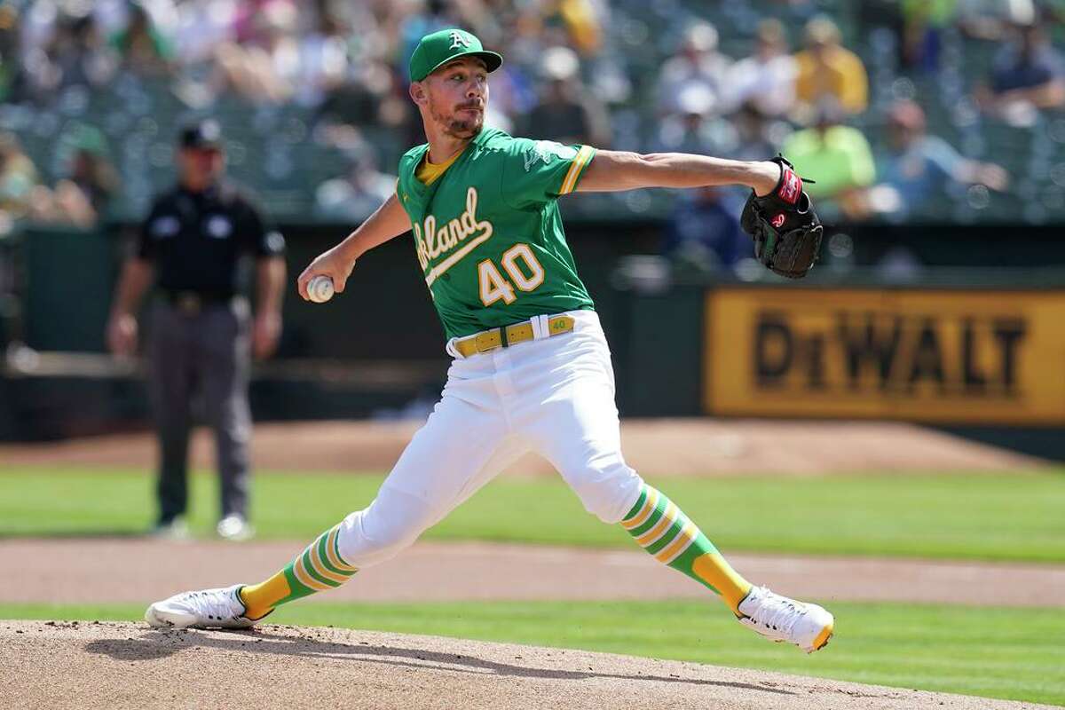 Oakland Athletics' Chris Bassitt pitches against the Seattle Mariners during the first inning of a baseball game in Oakland, Calif., Thursday, Sept. 23, 2021. (AP Photo/Jeff Chiu)