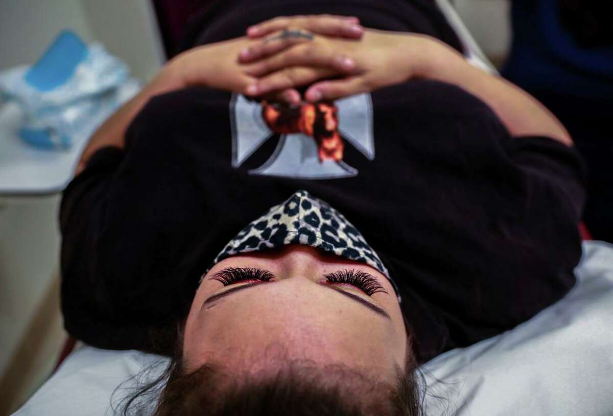 Ianthe Davis, 27, who traveled three hours from Dallas, lies still during an ultrasound at the Trust Women clinic in Oklahoma City. Davis was six weeks pregnant and unable to get an abortion in her home state, so she was forced to drive to Oklahoma.