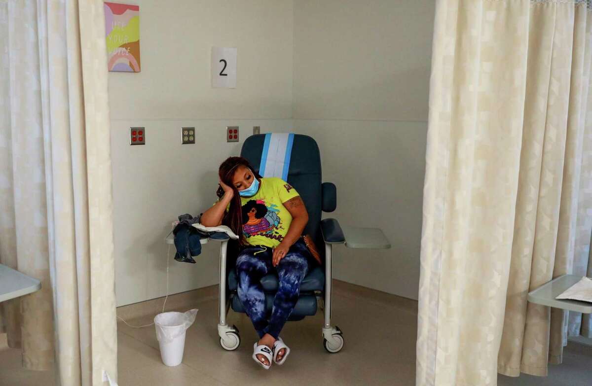 After traveling three hours from Dallas, Daffany McCoy, 28, rests in the recovery room after getting a surgical abortion at the Trust Women clinic in Oklahoma City.