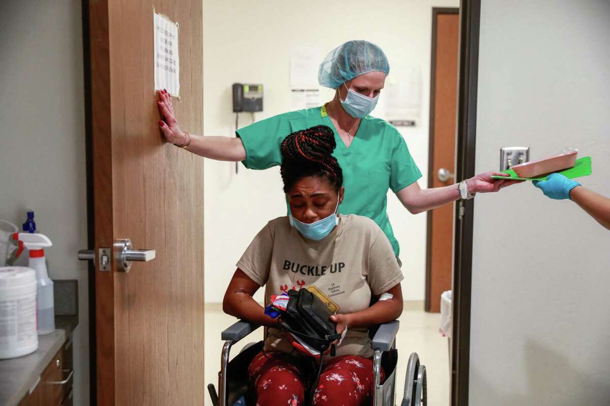 Volunteer Jennifer Goodner helps patient Judith, 33, in a wheelchair after a surgical abortion at the Trust Women clinic in Oklahoma City. Judith had to travel more than six hours from Houston to get the procedure. Judith suffers from Type 1 diabetes and her partner, with whom she shares four kids, suffers from kidney failure. " I am sick. Why would I want to bring kids into this world? I know that if I'm gone no one can mother them like I do," she said.
