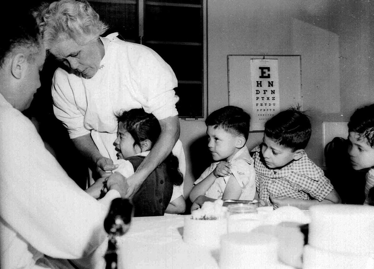 First- and second-graders at St. Vibiana’s school are among the first to be inoculated for polio with the Salk vaccine in Los Angeles in 1955.