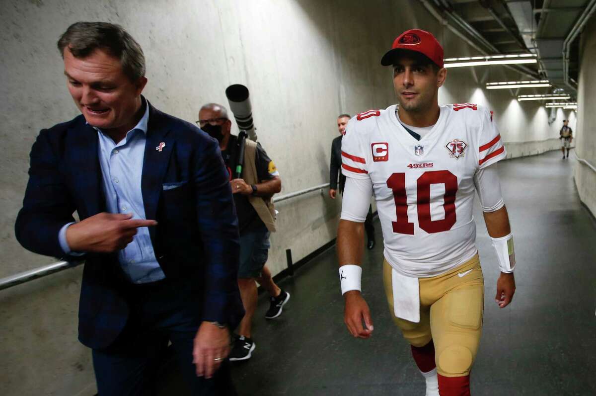 DETROIT, MI - SEPTEMBER 12: General Manager John Lynch, Jimmy Garoppolo #10 and Fred Warner #54 of the San Francisco 49ers head to the locker room after the game against the Detroit Lions at Ford Field on September 12, 2021 in Detroit, Michigan. The 49ers defeated the Lions 41-33. (Photo by Michael Zagaris/San Francisco 49ers/Getty Images)