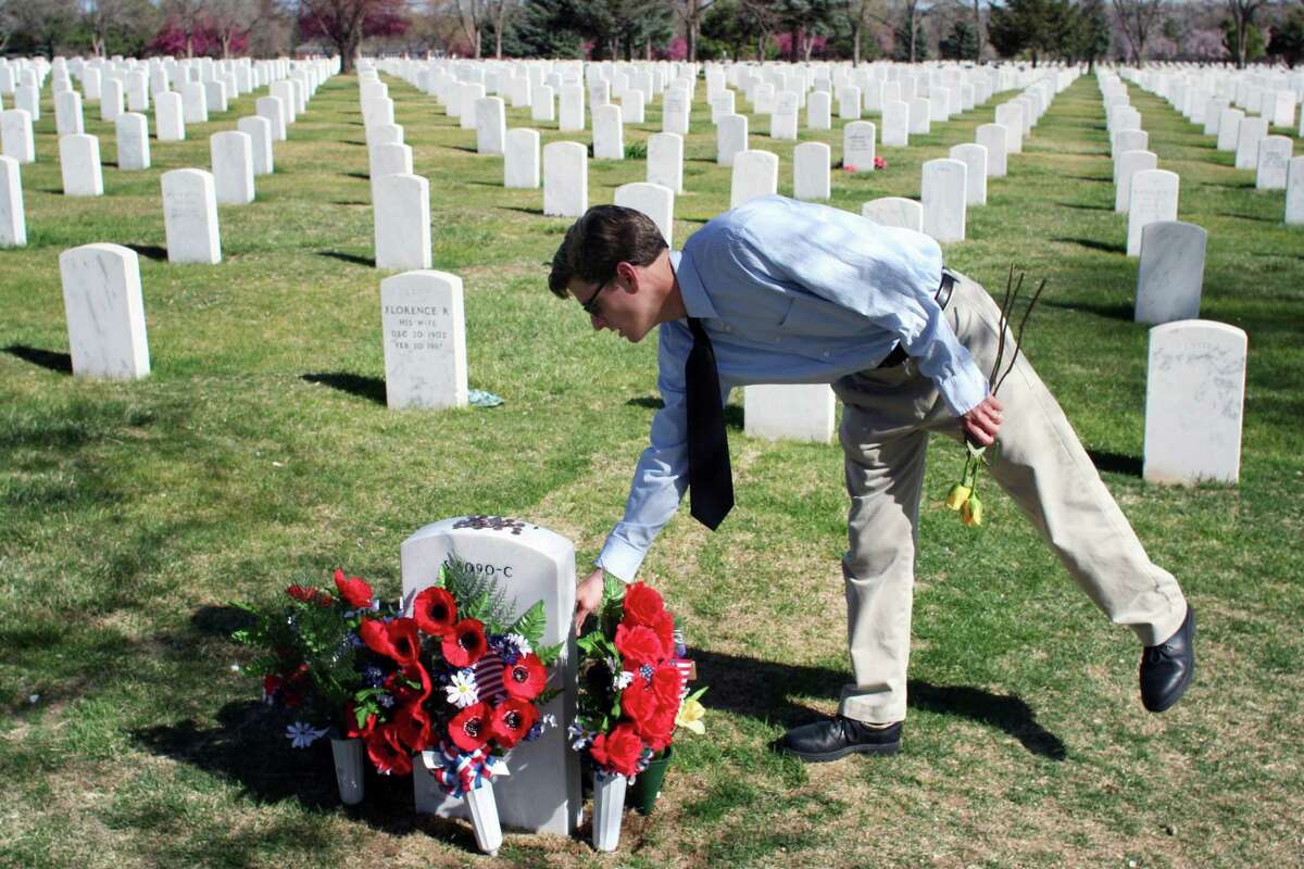 Rocky Mountain News reporter Jim Sheeler in 2006, on the morning he won the Pulitzer Prize in feature writing. He visited Fort Logan National Cemetery in Denver to honor some of the fallen Marines he wrote about in his article.