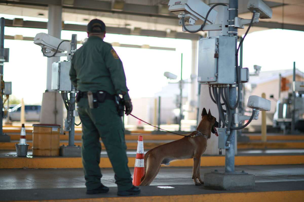 In this file photo, a U.S. Border Patrol agent is pictured with a K-9 agent at the Interstate Highway 35 border checkpoint.