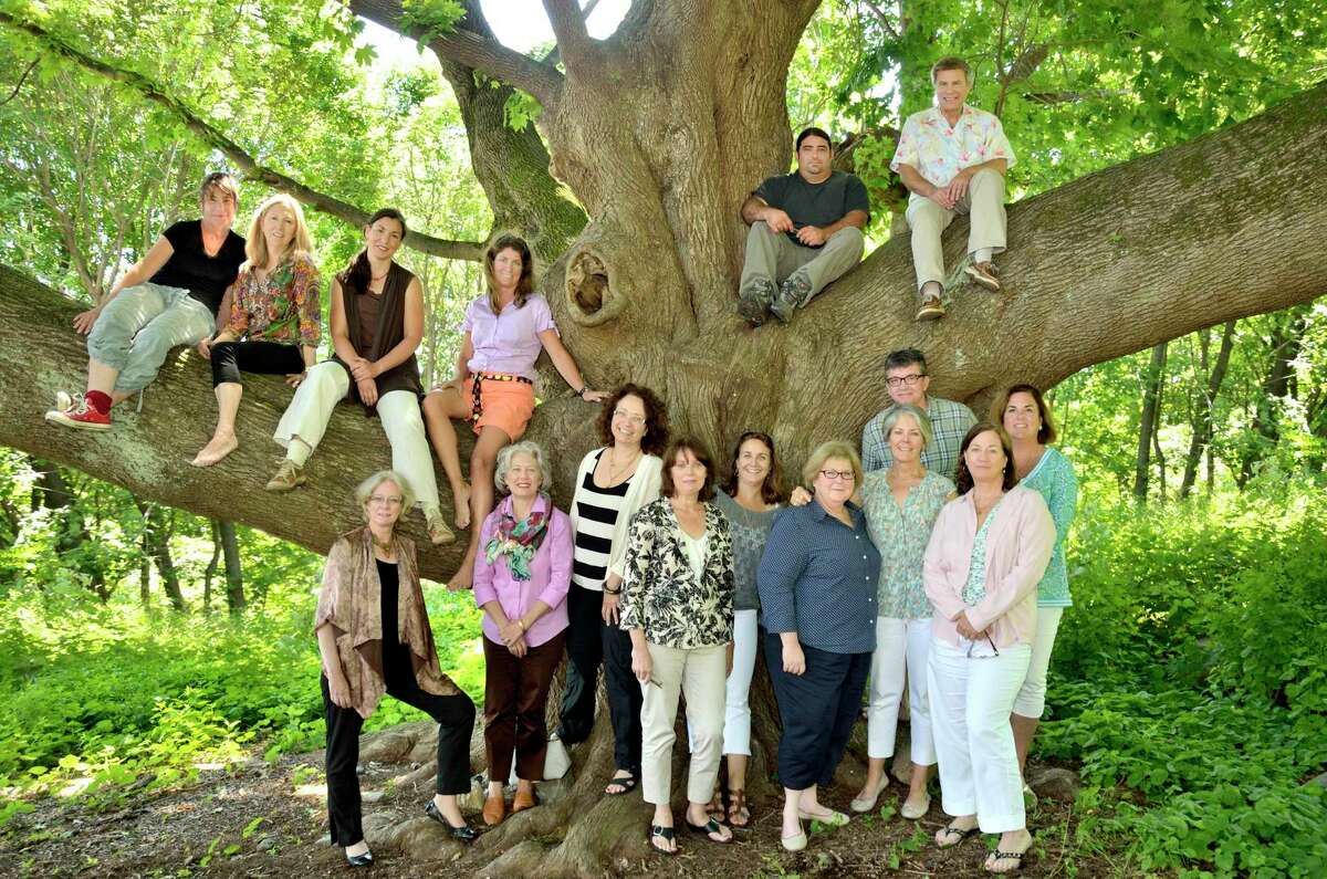 In 2014, members of the Ridgefield Guild of Artists re-create a photo taken in front of its Norway maple tree during the 1970s.  
