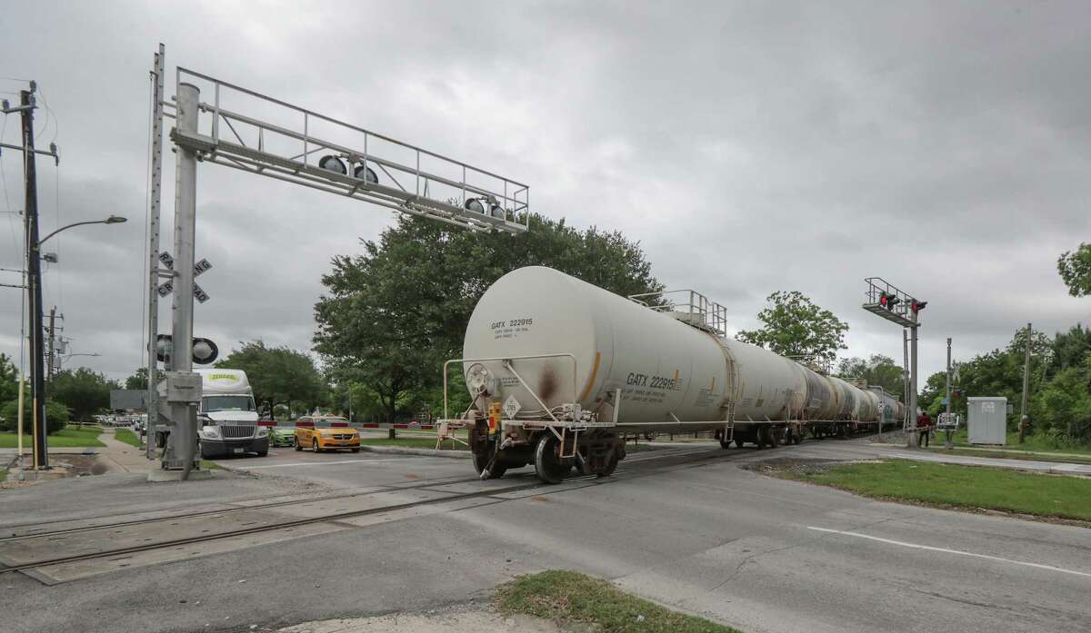 A train finally moves to open up traffic over tracks across Lockwood Avenue on May 18, 2021, in Houston.