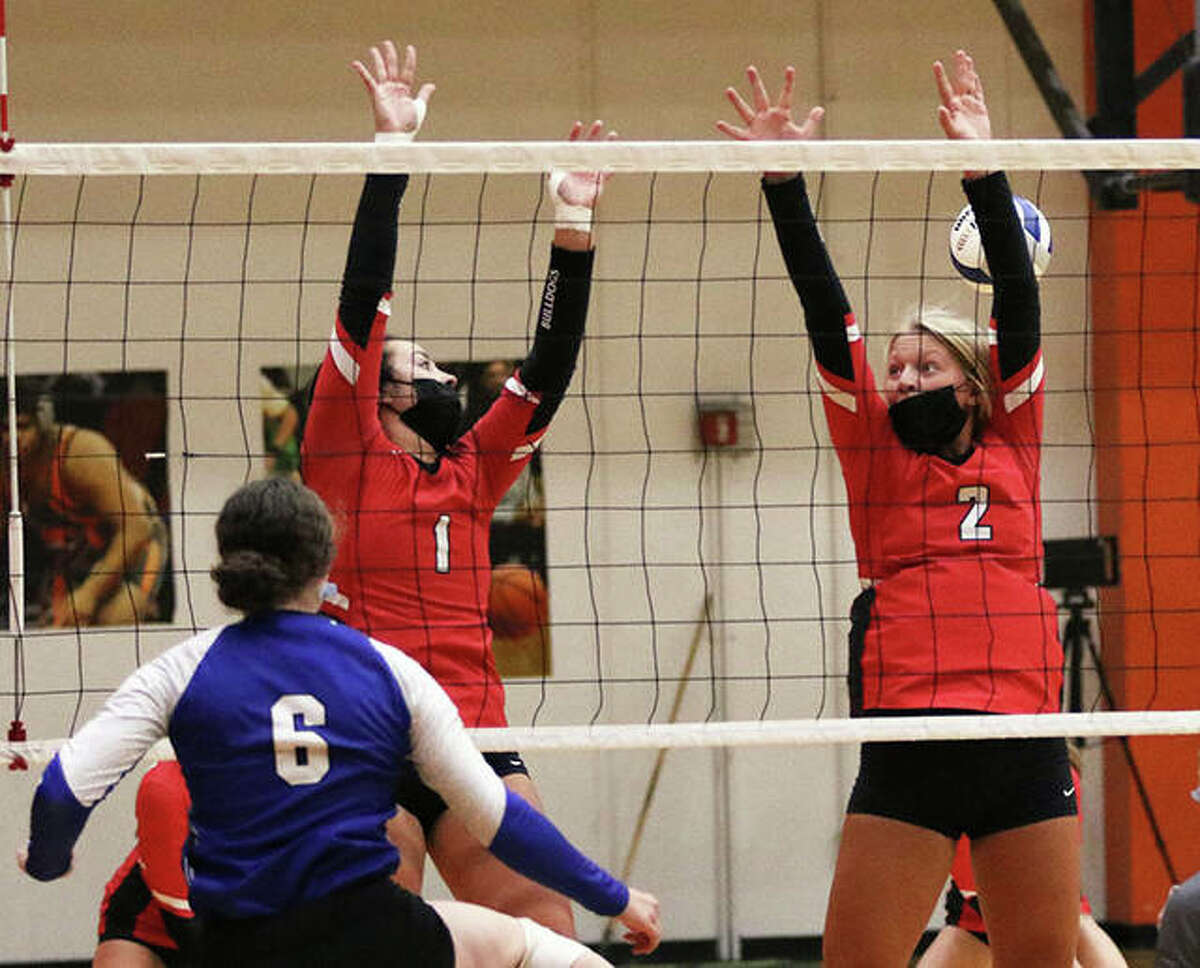 Freeburg’s Lindsey Muskopf (6) hits past the double block from Staunton’s Savannah Billings and Danielle Russell (2) during a Sept. 3 match at the Edwardsville Tourney. On Thursday, Staunton picked up a three-set SCC victory at Pana.