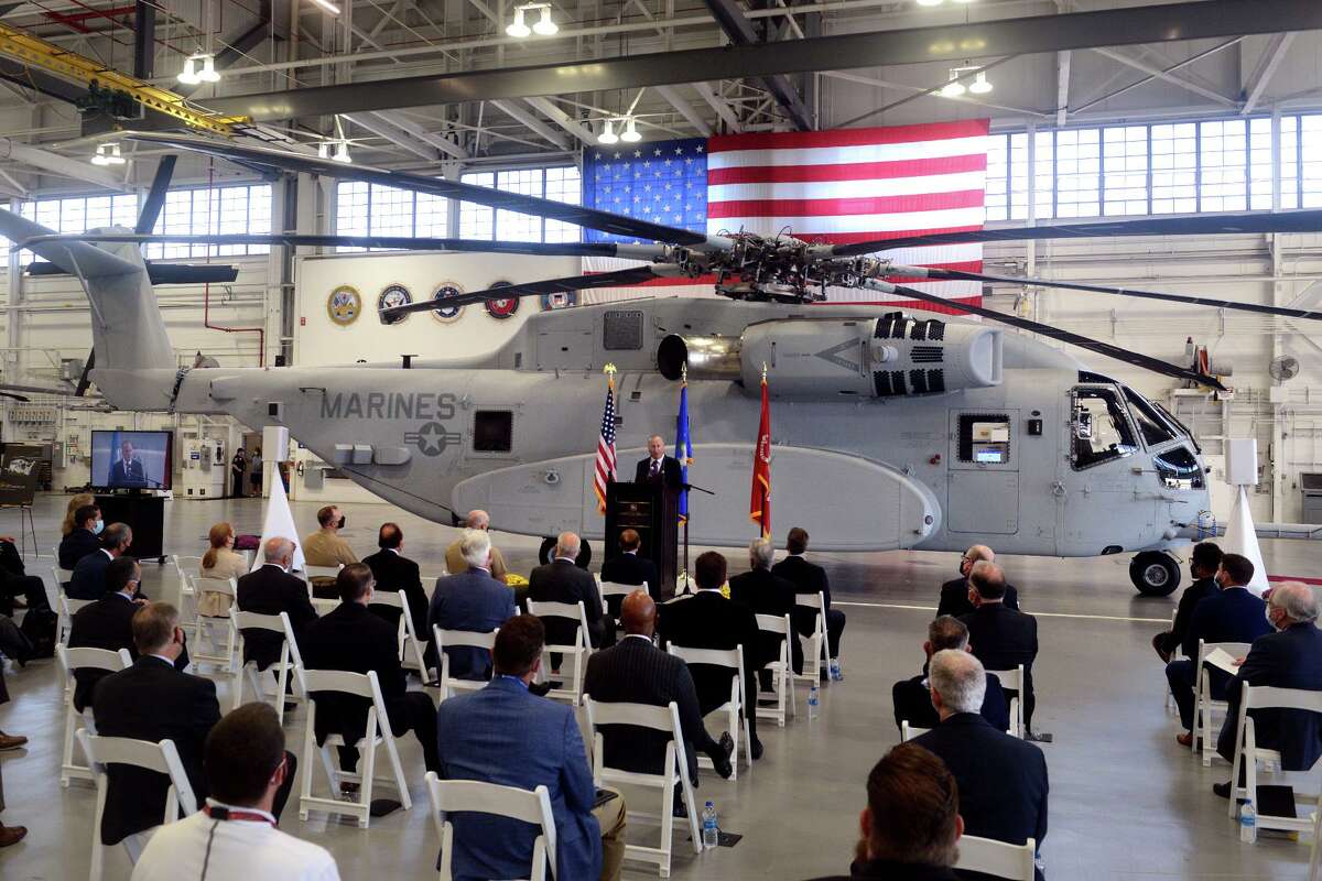 Sikorsky Aircraft President Paul Lemmo speaks during a ceremony next to the first Connecticut built Sikorsky CH-54K King Stallion helicopter held in a hangar at Sikorsky headquarters in Stratford, Conn. Sept. 24, 2021. The new generation of the CH-53’s are being built in Stratford for the U.S. Marines.
