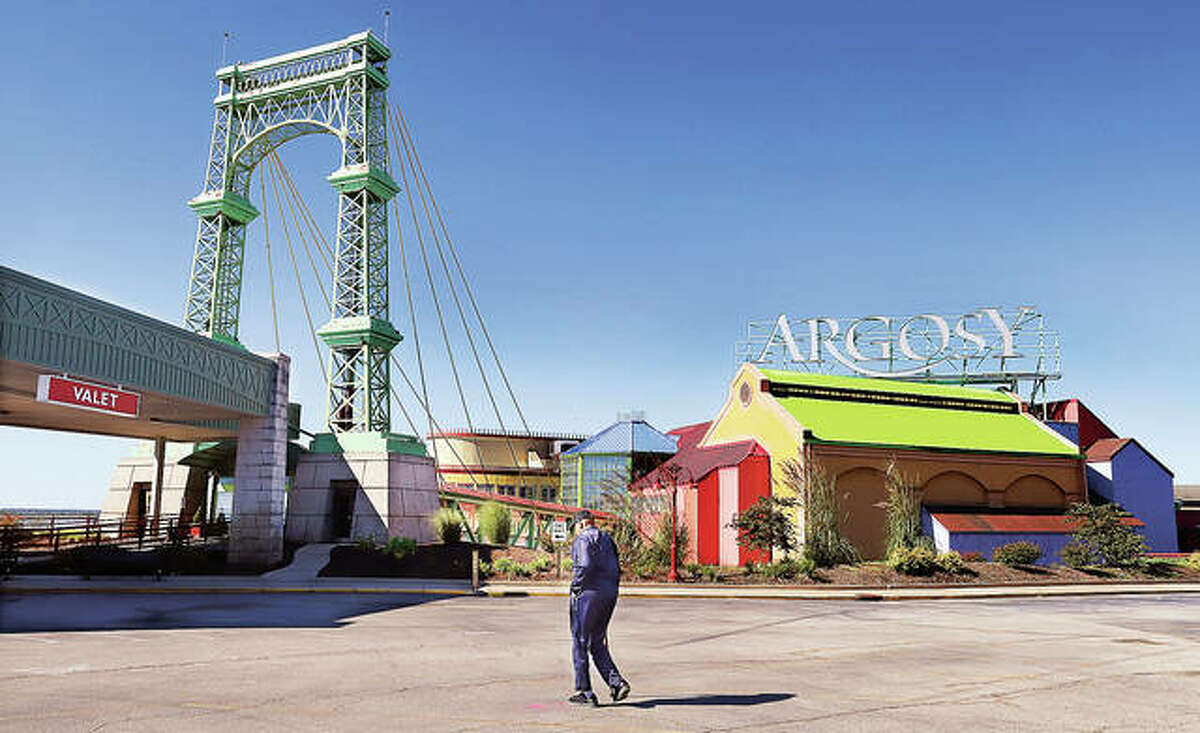 A customer walks toward the entrance of the Argosy Casino Alton on Thursday. The casino this month is marking its 30th anniversary and its role in history as the first modern gambling riverboat in Illinois. - John Badman|The Telegraph
